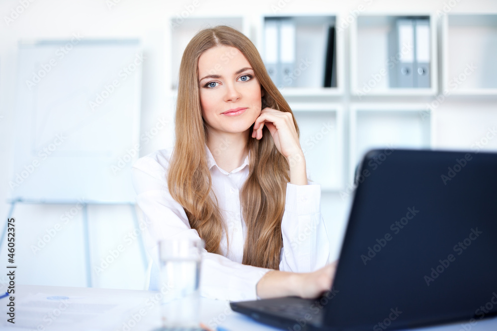 Portrait of beautiful young smiling business woman