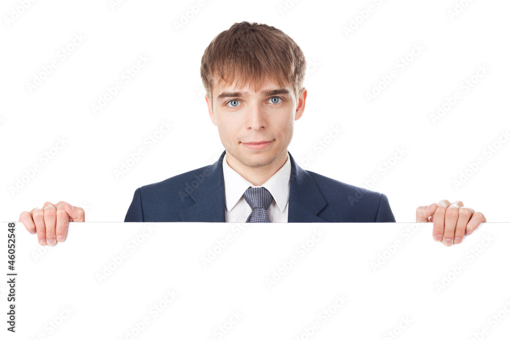 young smiling businessman holding white blank board isolated on young smiling businessman holding white blank board isolated on