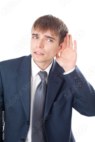 business man in listening pose isolated on white background