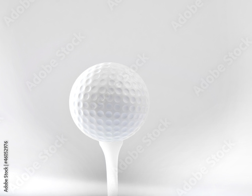golf ball on tee and grey space background