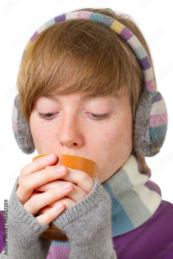 Pretty smiling girl in winter clothes with a cup of hot drink Pretty smiling girl in winter clothes with a cup of hot drink