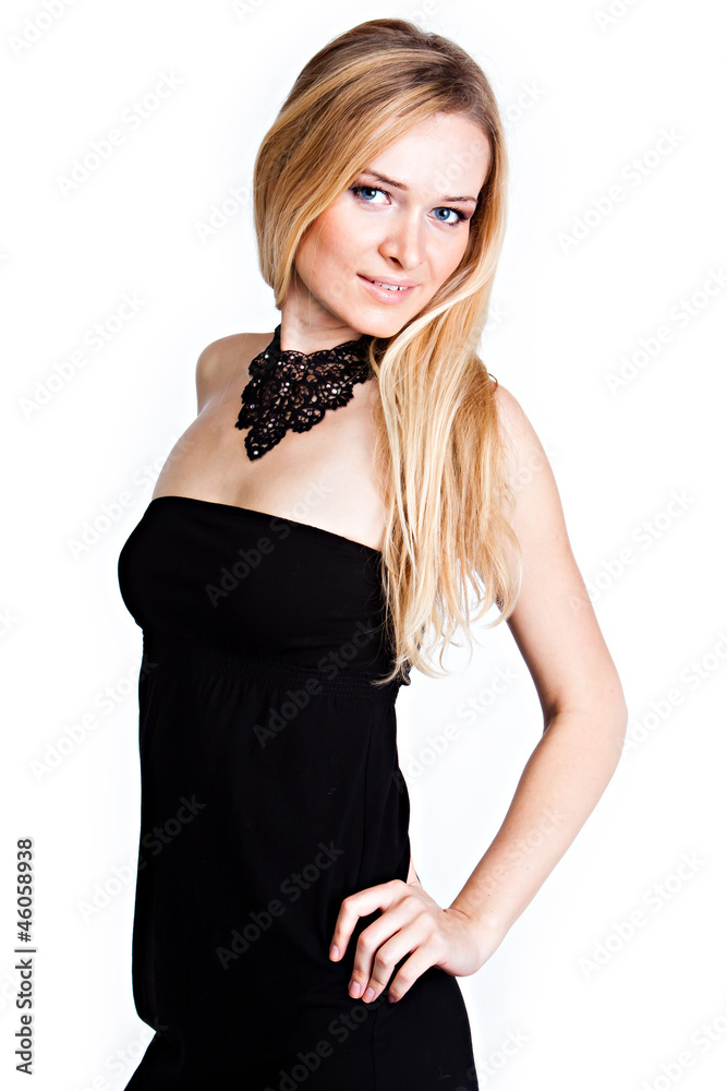 Young and beautiful woman in a black cocktail dress Young and beautiful woman in a black cocktail dress