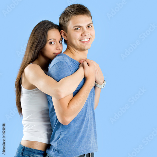 pretty young female hugging her boyfriend
