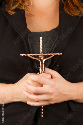 Woman in black with the cross in hands
