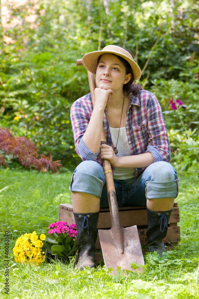 Junge Frau im Garten, young woman in a garden StockFoto Adobe Stock