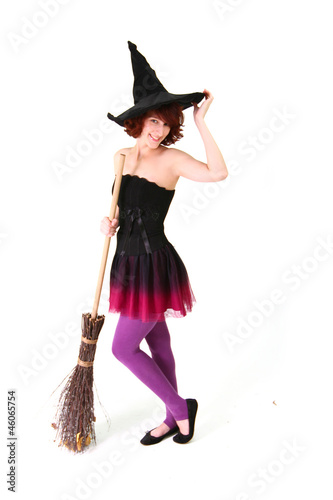 Halloween witch with a broom isolated over white background