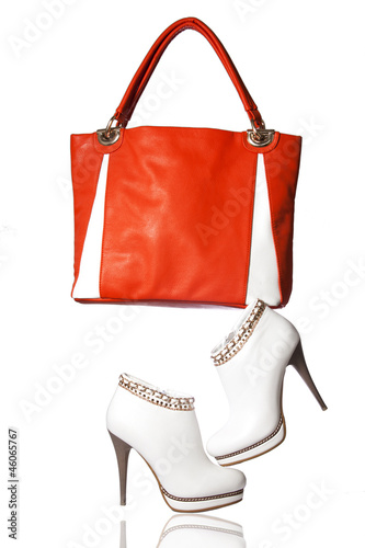A pair of women's ankle boots and handbag