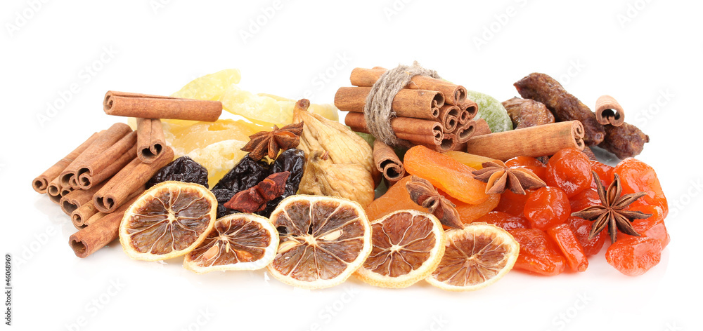 Dried fruits with cinnamon and anise stars isolated on white Dried fruits with cinnamon and anise stars isolated on white