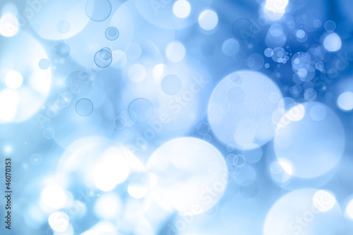 Abstract blue and white blurred circles background