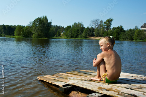 Little girl sits on a raft