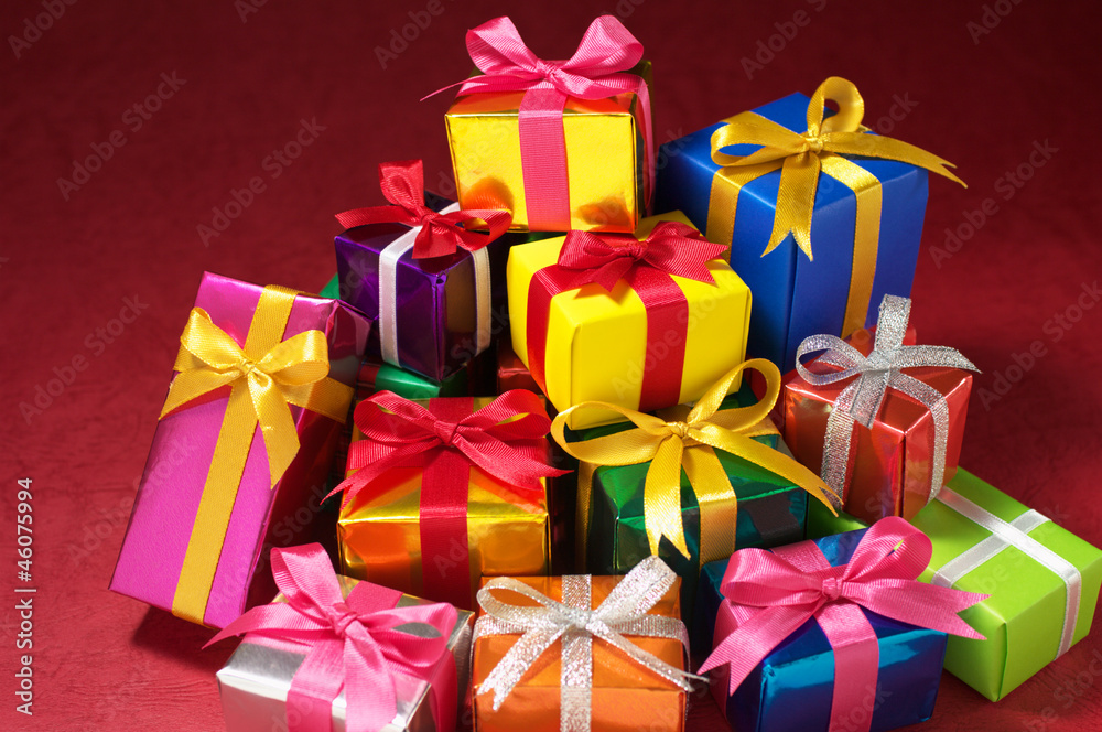 Pile of small gifts on red background. Pile of small gifts on red background.