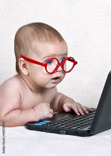 Funny kid with a laptop