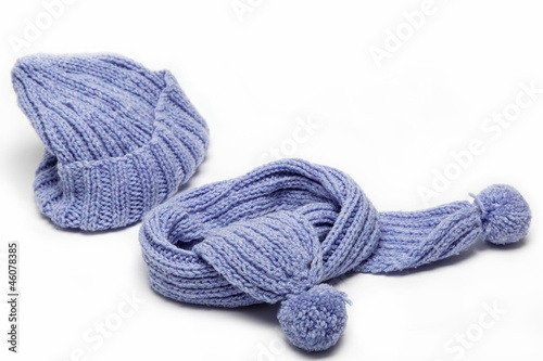 Cold winter clothing - hat or cap, scarf. © trotzolga