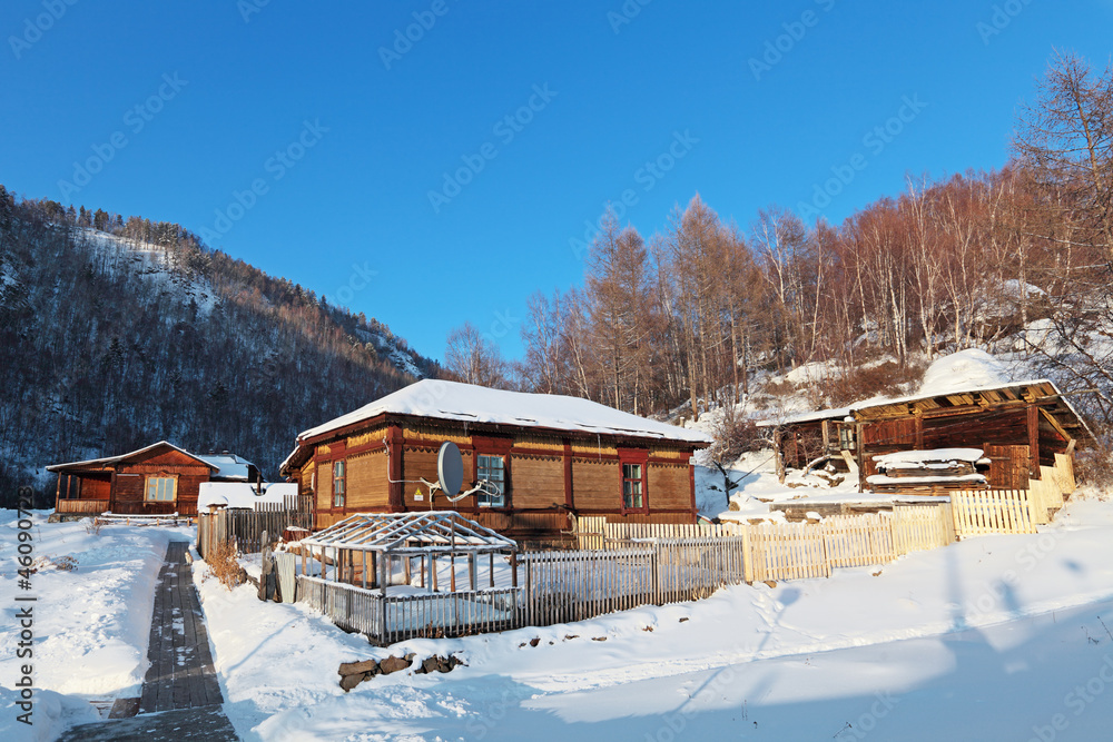 Siberian village in the mountains, winter landscape