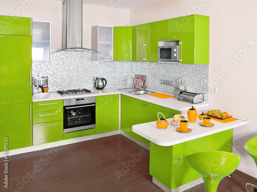 Modern kitchen interior with green decoration