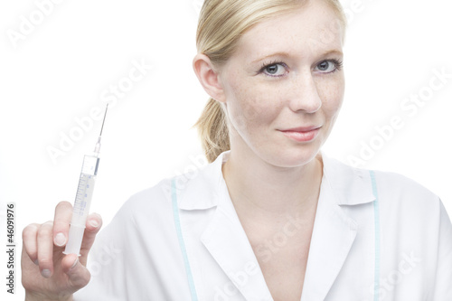 Beautiful young nurse with syringe
