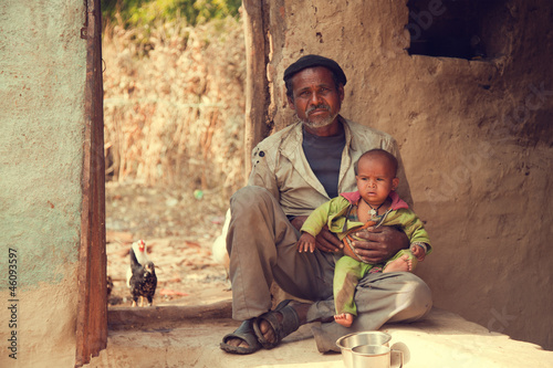 Indian poor father and son photo