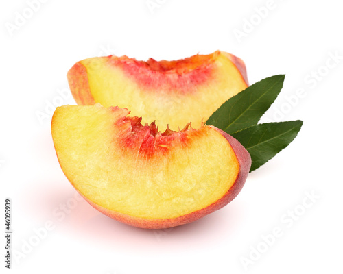 Slices of peach with leaves