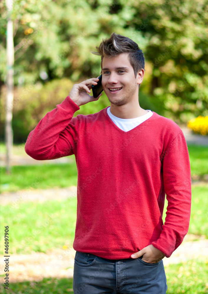 Young man communicating on smartphone Young man communicating on smartphone