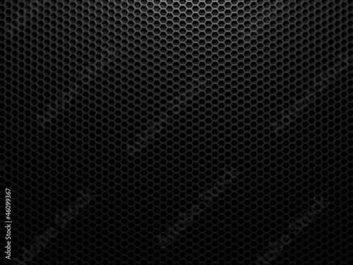 Black metal background with hexagon holes