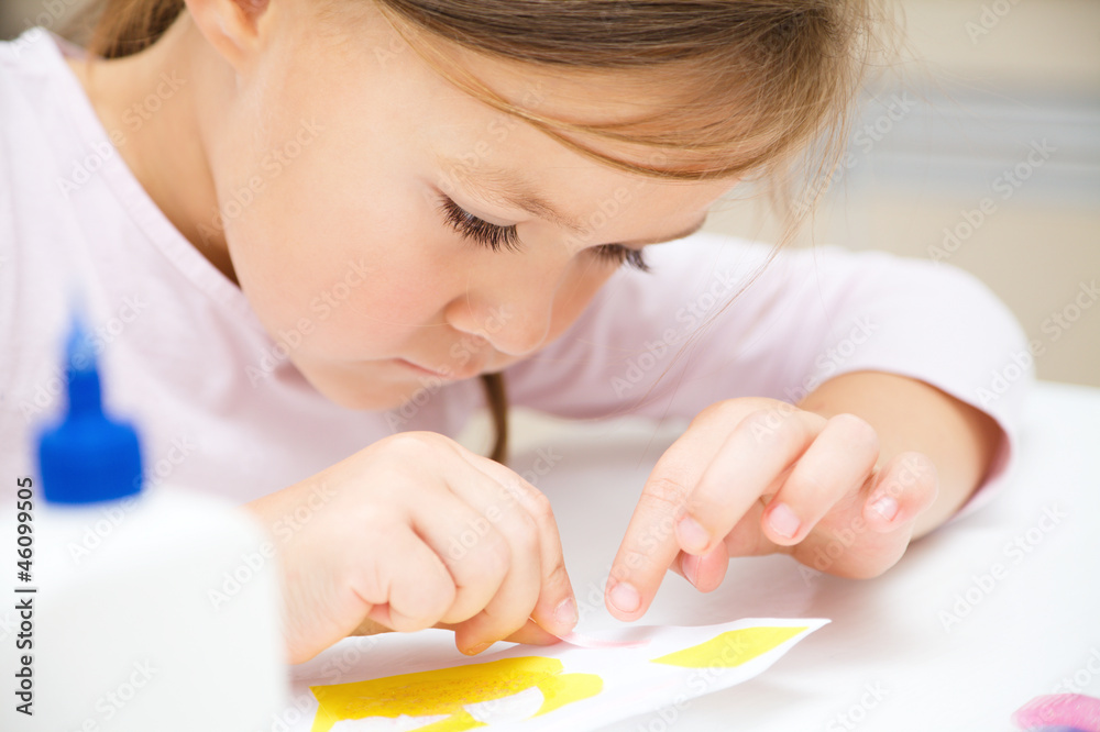 Little girl doing arts and crafts in preschool Little girl doing arts and crafts in preschool