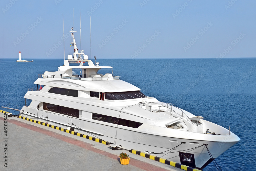 Fototapeta premium White motor yacht over harbor pier, Odessa, Ukraine