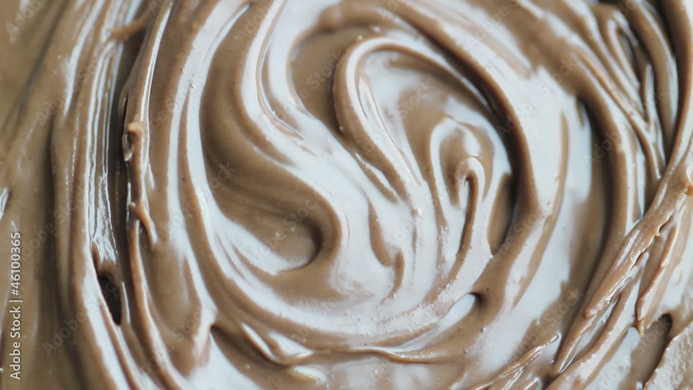 background from rotate chocolate-peanut butter closeup background from rotate chocolate-peanut butter closeup