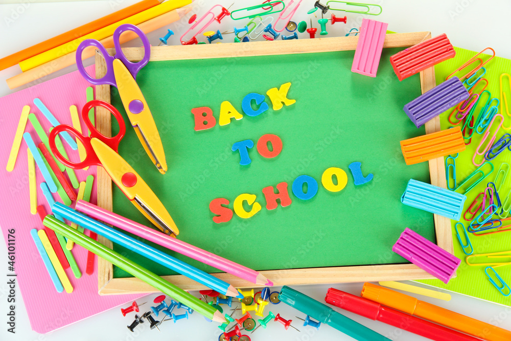 Small chalkboard with school supplies