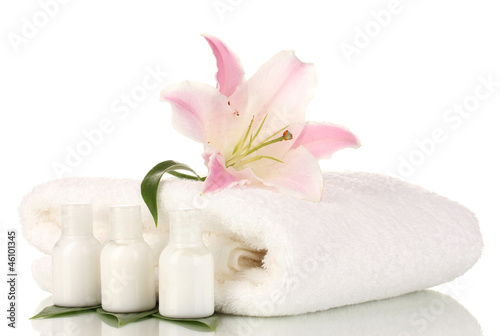 Fototapeta Naklejka Na Ścianę i Meble -  beautiful lily with towel and bottles isolated on white