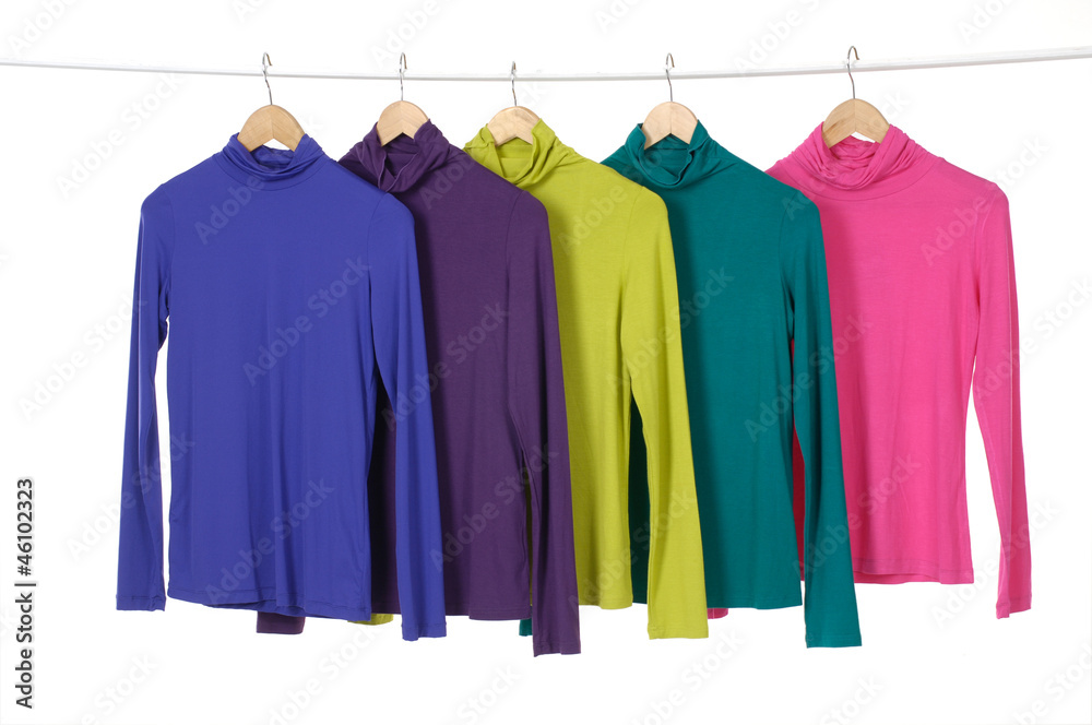Close up 4 colorful clothing on hanger in a row