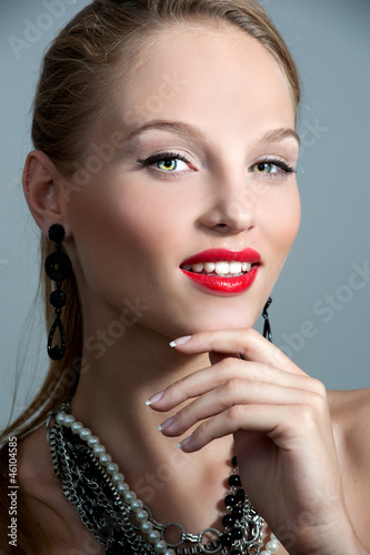 Beautiful woman with evening make-up. Jewelry and Beauty. Fashio