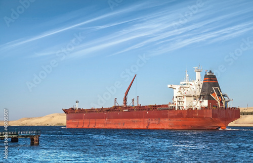 Big red oil tanker passes through the Suez Canal