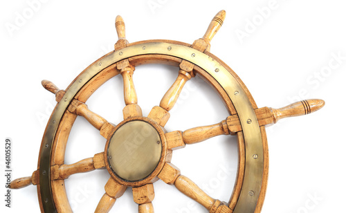 Old wooden steering wheel on white background