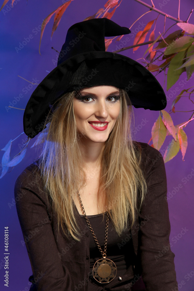 Fototapeta premium Halloween witch on gray background