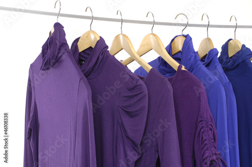 Colorful seven clothing on hanger rack display