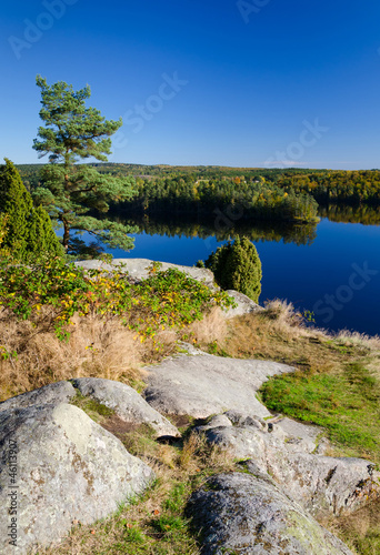 Vertical autumn lake landscape from Swedish hill