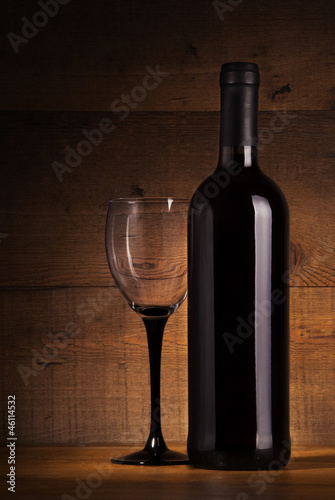 Wine bottle and glass on the table