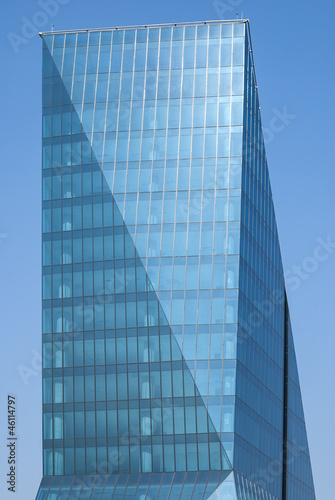 Contemporary office building side  blue glass windows