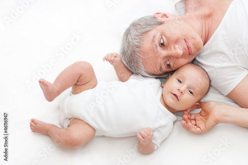 Grandmother playing with a baby