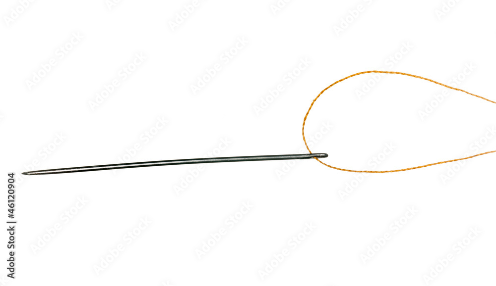Orange thread through eye of needle Orange thread through eye of needle