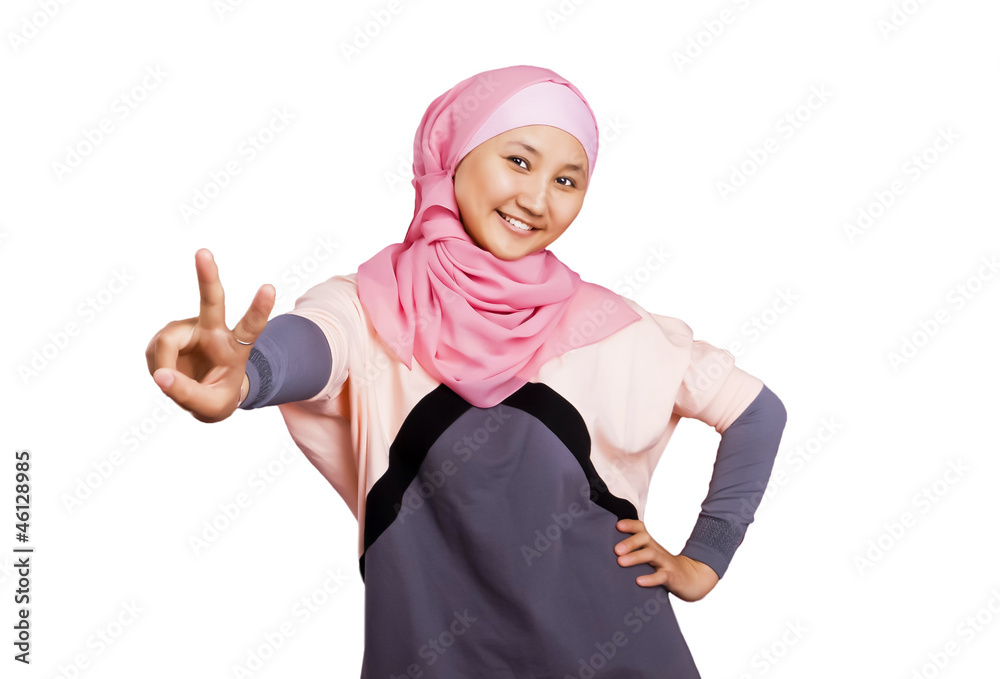 Beautiful young muslim woman make peace by her fingers isolated on white background Beautiful young muslim woman make peace by her fingers isolated on white background