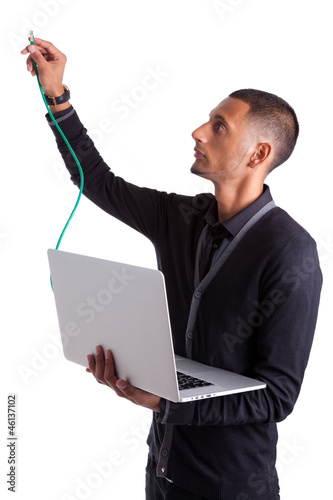 Young african american computer scientist plugin a ethernet cabl photo
