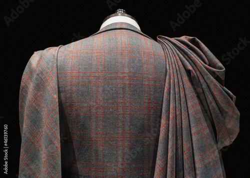 Mannequin in checkered suit with fabric folds