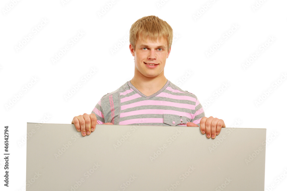 A smiling man with a blank behind isolated on white A smiling man with a blank behind isolated on white
