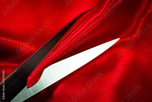 scissors on red fabric