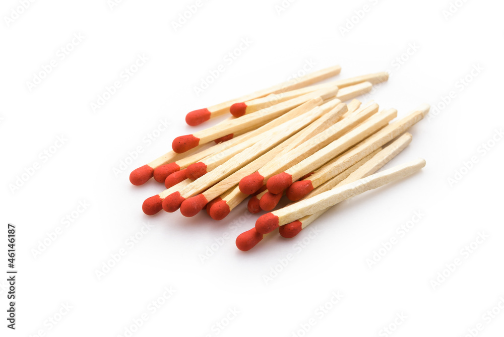 matchsticks stack up on white