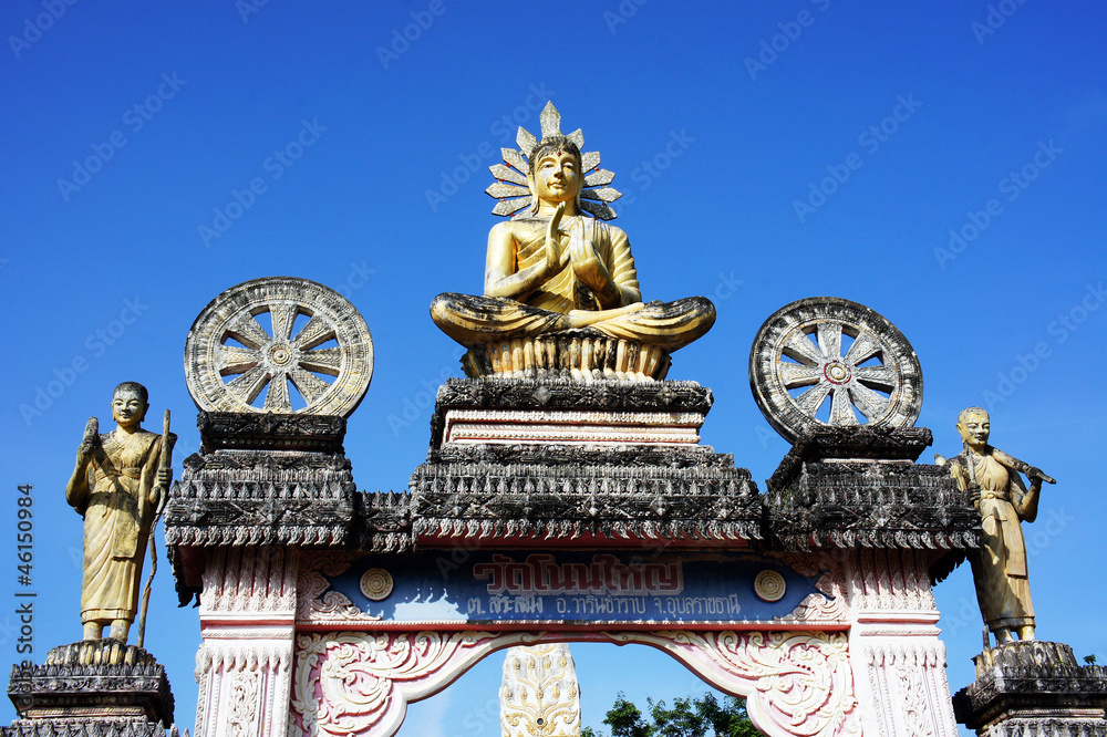 Buddha on a temple door and the sky