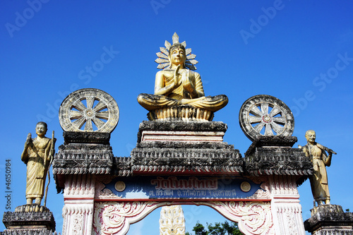 Buddha on a temple door and the sky
