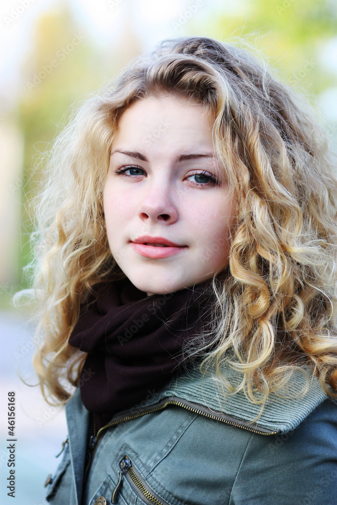 Naklejka premium Blonde girl with curly hai
