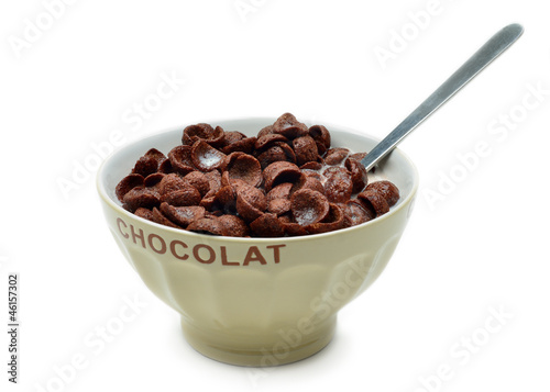 Bowl with chocolate cornflakes, cereals and milk
